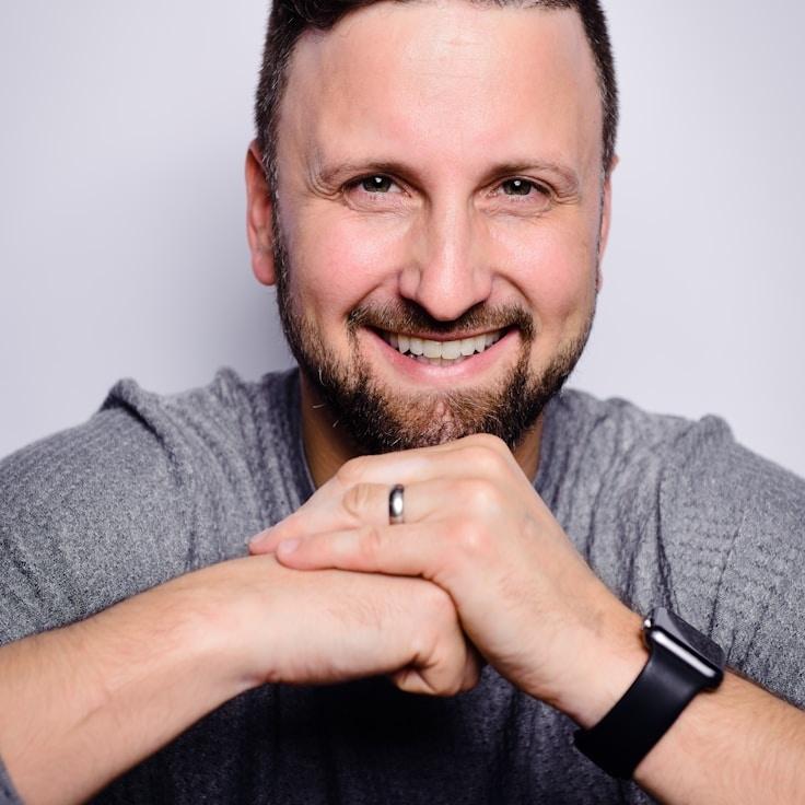 Avery Collins, Lead Design Curator at SoftIslandRoute, reviewing corporate floral arrangements